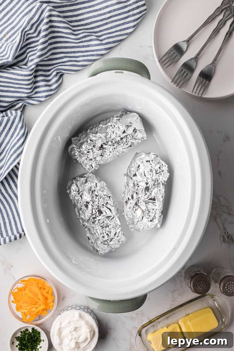 Perfect Slow Cooker Baked Potatoes: Creamy, Hands-Off Recipe 7 potatoes in the slow cooker to be cooked.