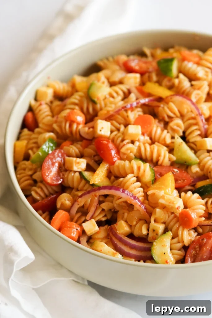 pasta salad with colorful vegetables in a large bowl