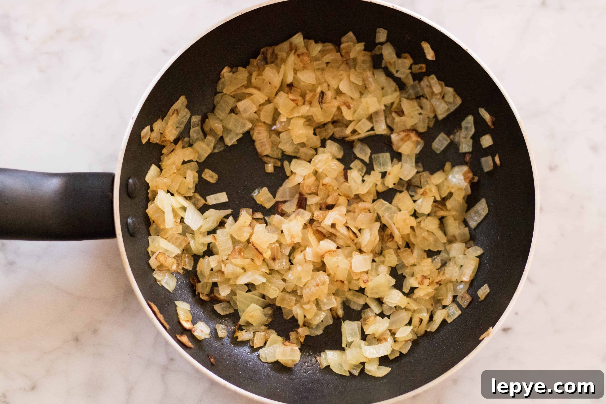 Sweating minced onion on the pan