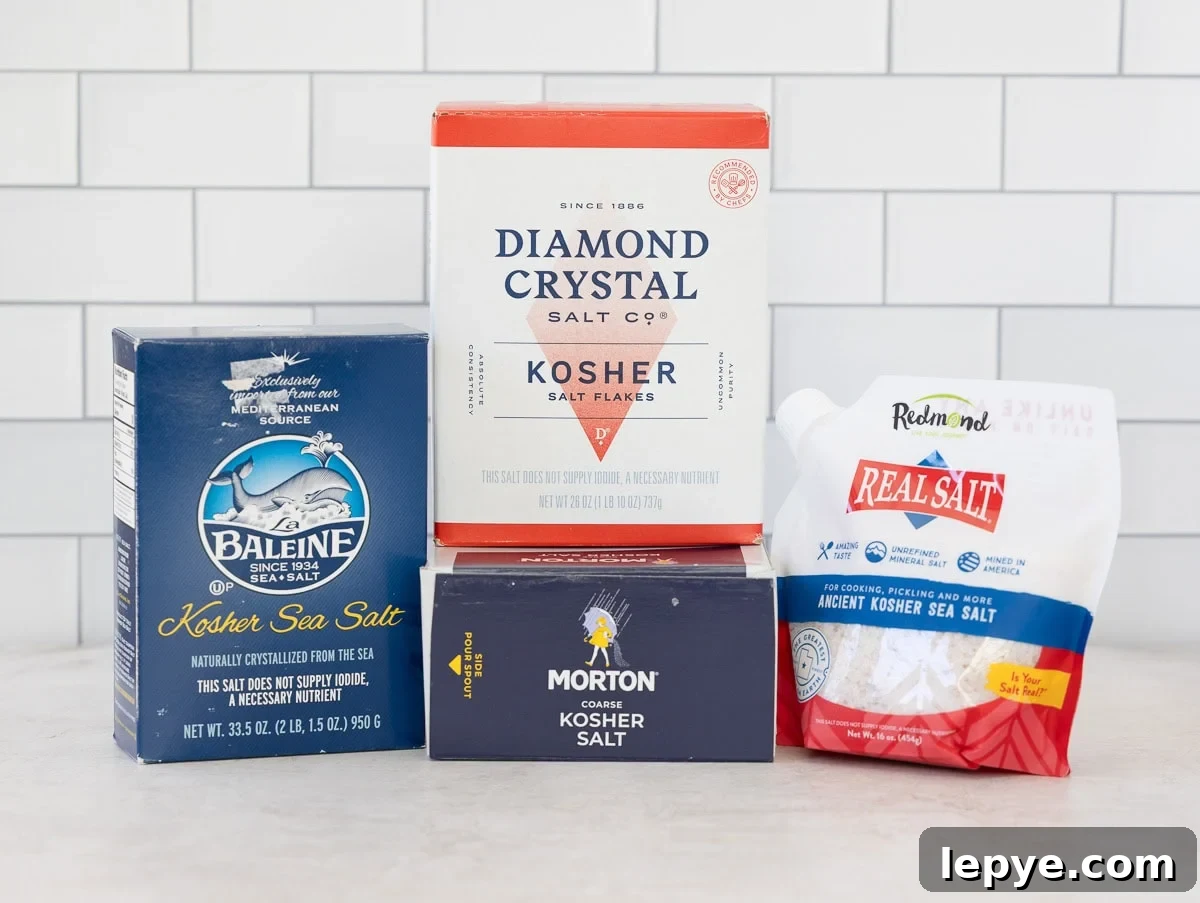 Boxes of different kosher salts for brining on a kitchen counter.