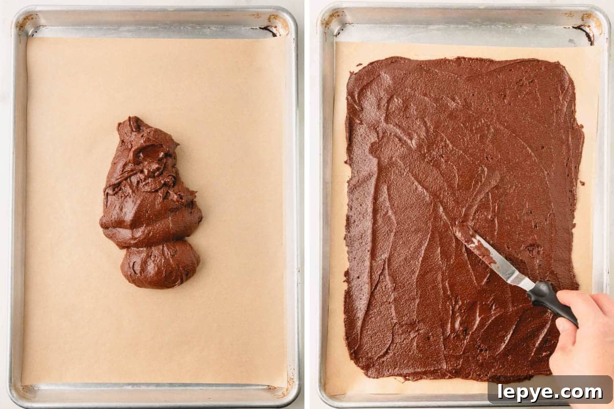 Crunchy Brownie Crisps: Chocolate Bites Recipe 6 Brownie crisp batter being spread over a parchment lined baking sheet.
