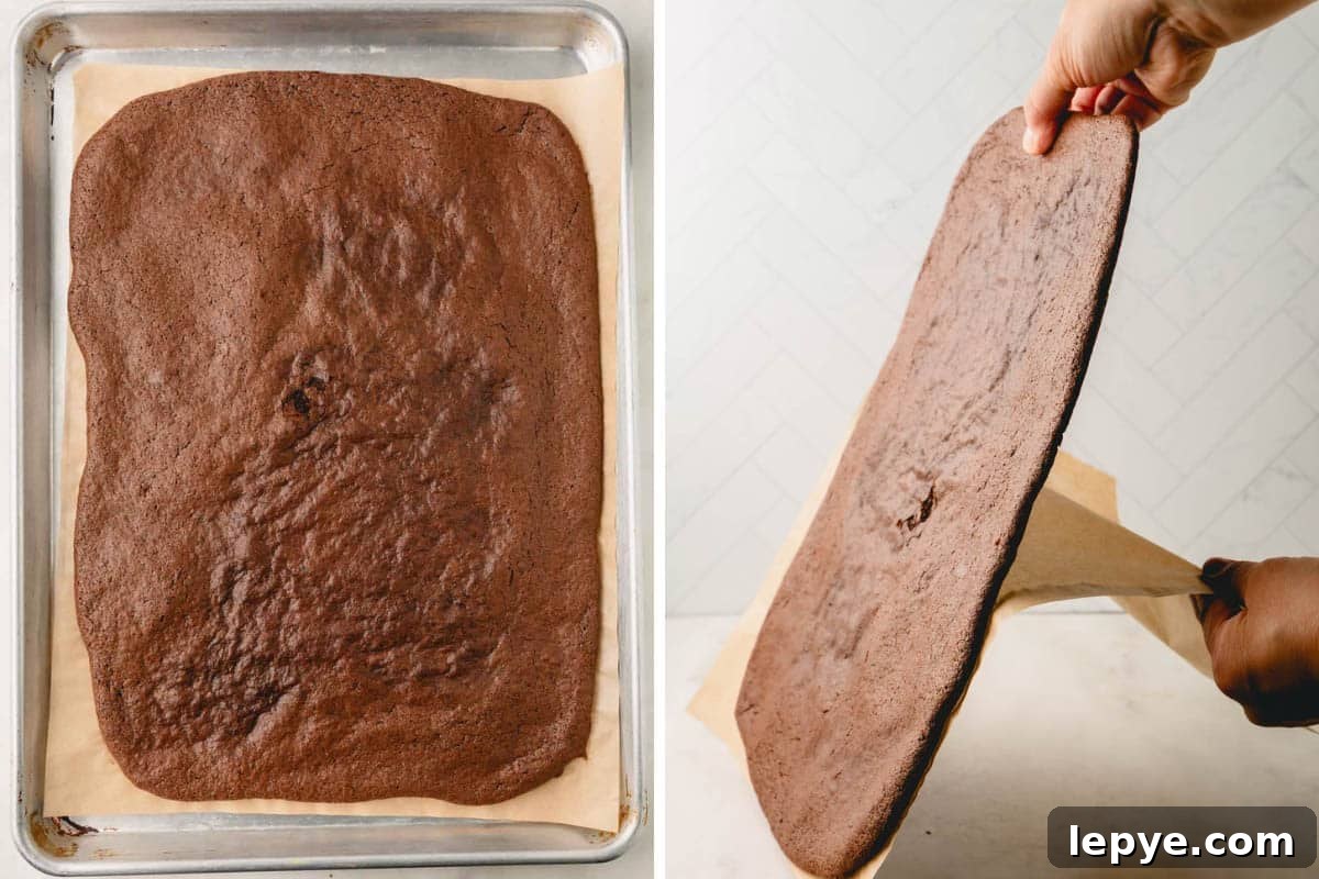 Crunchy Brownie Crisps: Chocolate Bites Recipe 7 A slab of dried brownie crisp on parchment paper and being peeled from the paper.