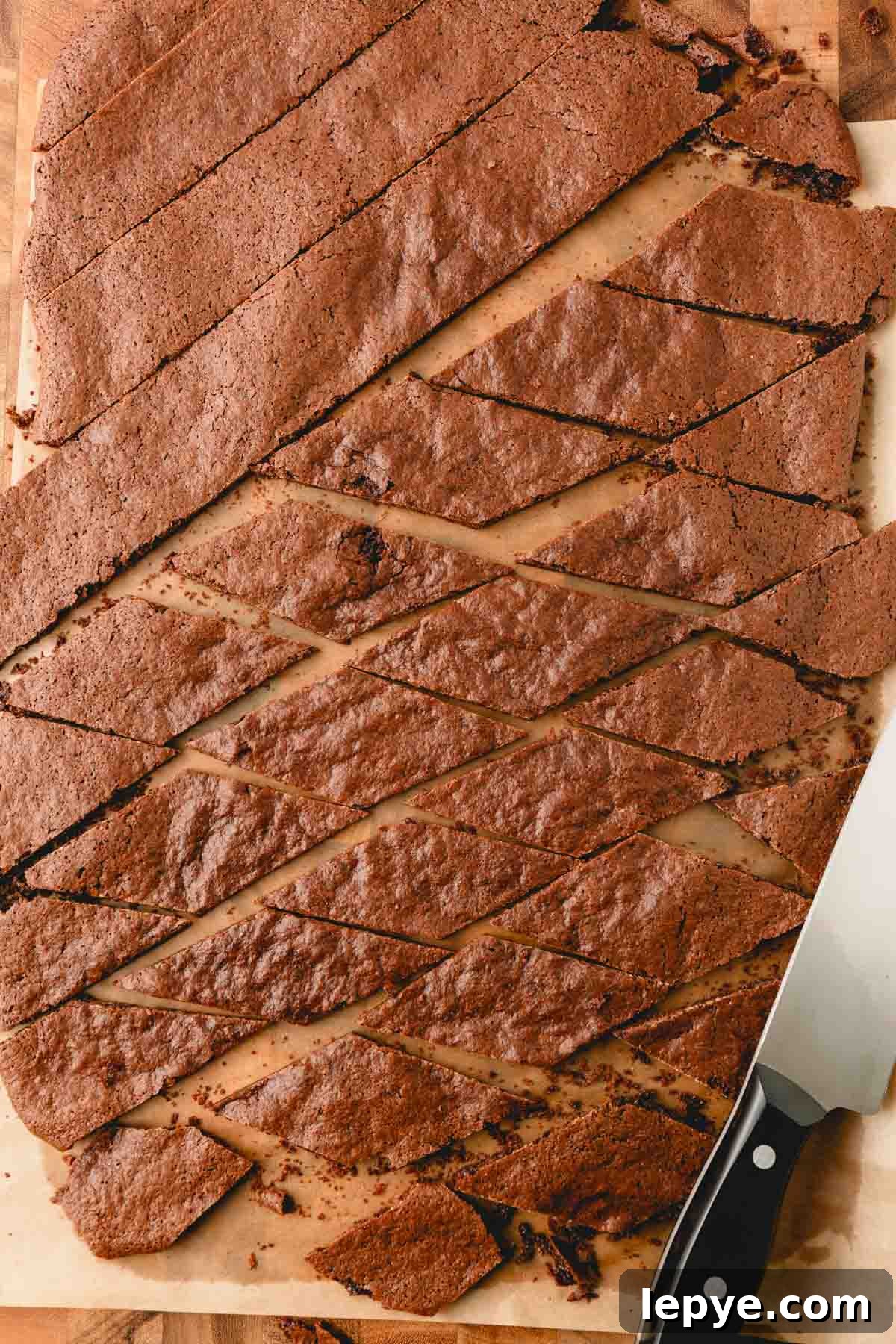 Crunchy Brownie Crisps: Chocolate Bites Recipe 8 A slab of brownie crisp being cut into pieces.