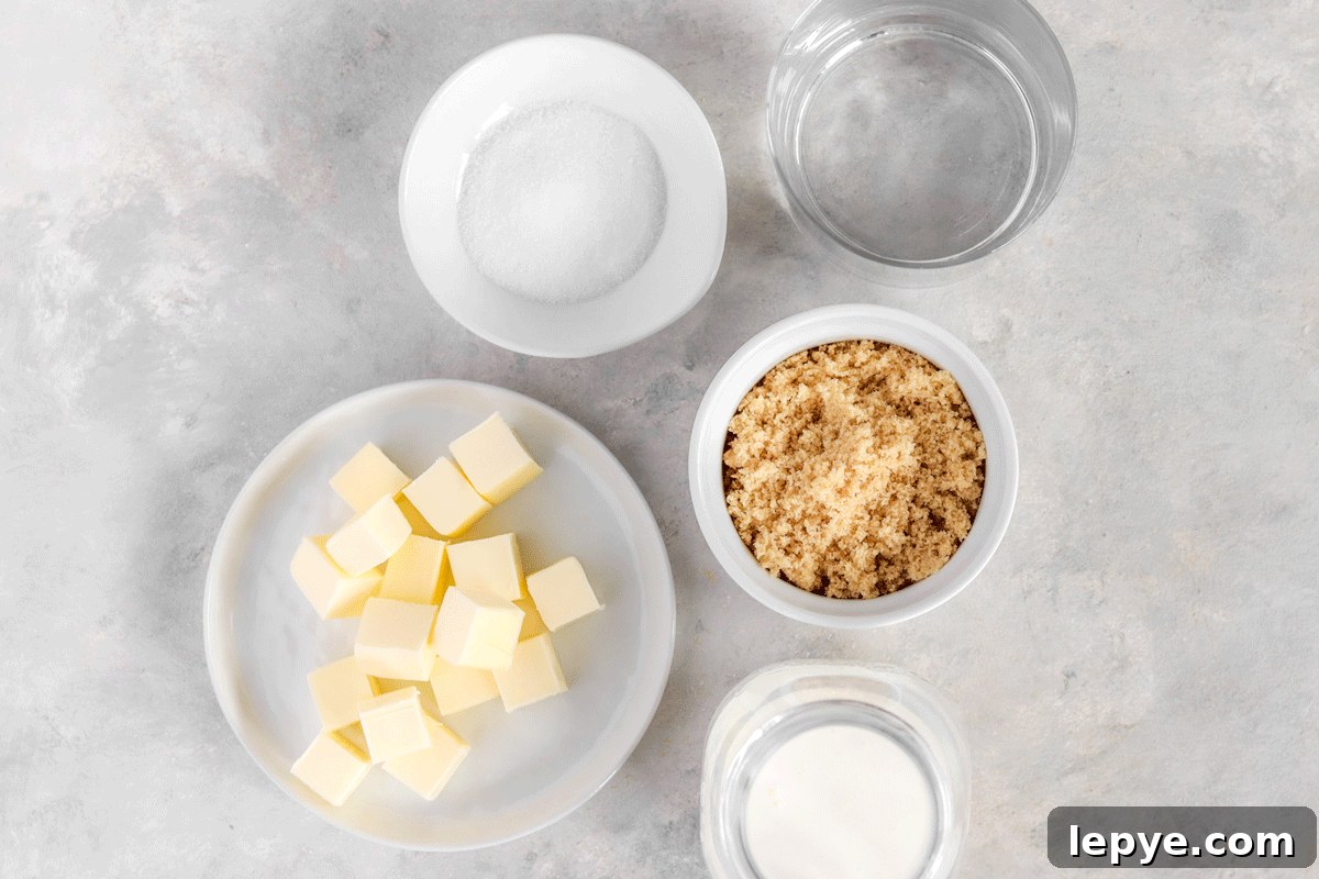 DIY Smooth Caramel Dip Recipe Without Condensed Milk 3 Brown sugar, butter, heavy cream, salt and water set out in bowls on a counter