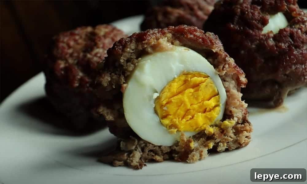 15 High-Protein Breakfasts to Power Your Morning Hustle 16 Scotch eggs with ground beef one cut in half.