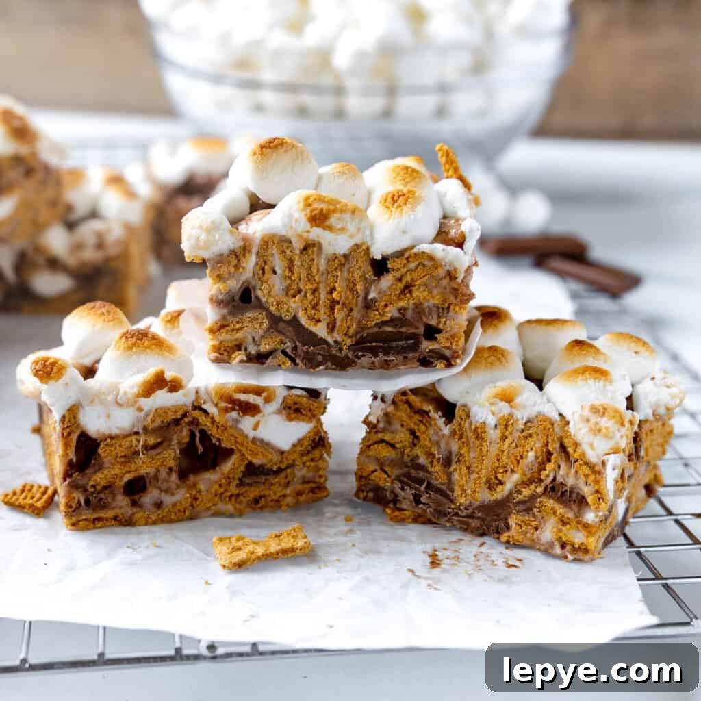 Three S'mores bars stacked on top of each other.
