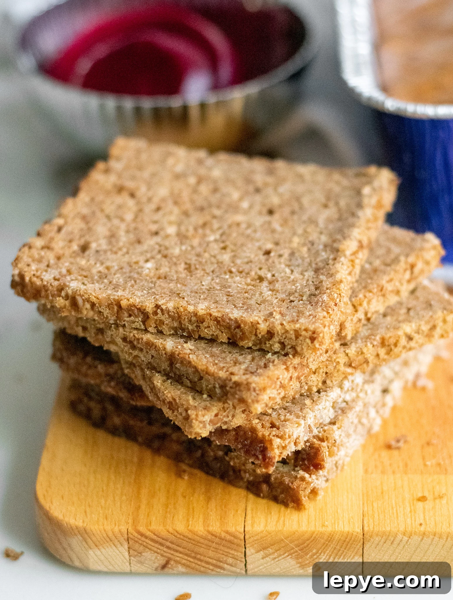 How to Make Classic Danish Leverpostej (Liver Pâté) 6 Rye bread in a stack on a cutting board.