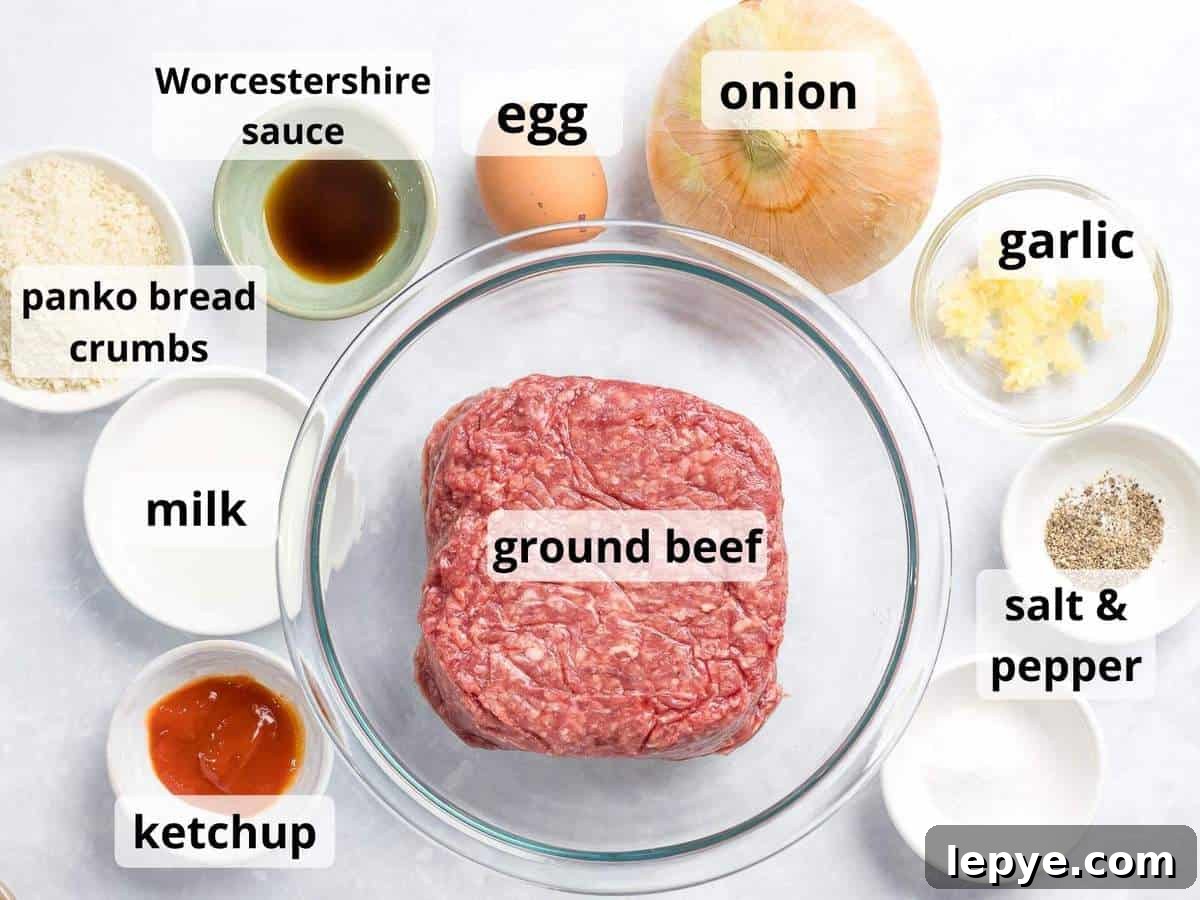 Ingredients for Japanese hamburger steak patty including ground beef, onions, and panko bread crumbs.