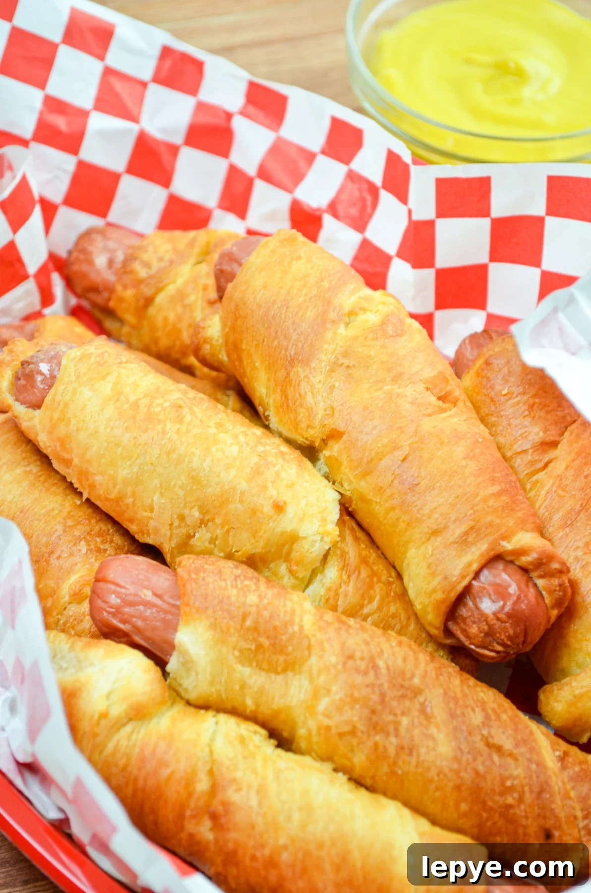 Crispy Air Fryer Pigs in a Blanket Recipe 8 A basket full of air fryer pigs in a blanket.