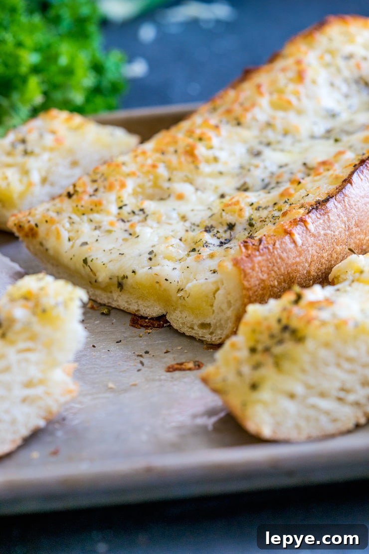 The Best Cheesy Garlic Bread! Buttery, tangy, garlicky, and so, so cheesy.