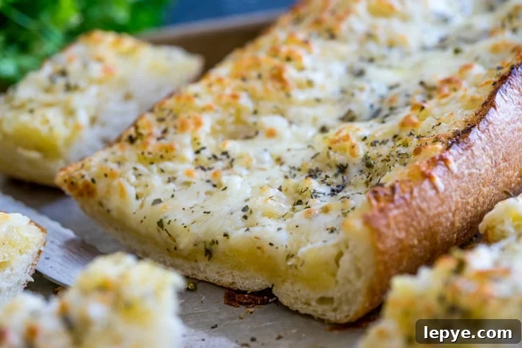 The Best Cheesy Garlic Bread! Buttery, tangy, garlicky, and so, so cheesy.