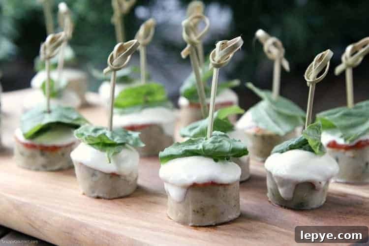 EASY CHICKEN PARMESAN SAUSAGE BITES Easy Chicken Parmesan Sausage Bites on cutting board