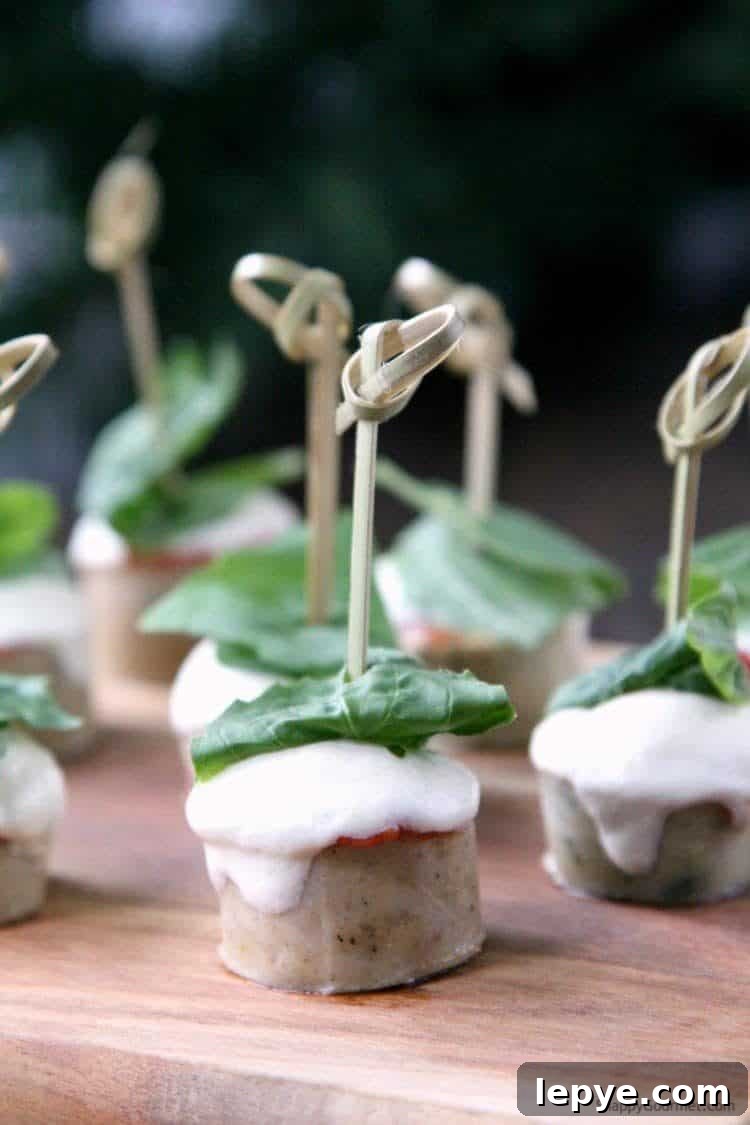 EASY CHICKEN PARMESAN SAUSAGE BITES Easy Chicken Parmesan Sausage Bites on cutting board