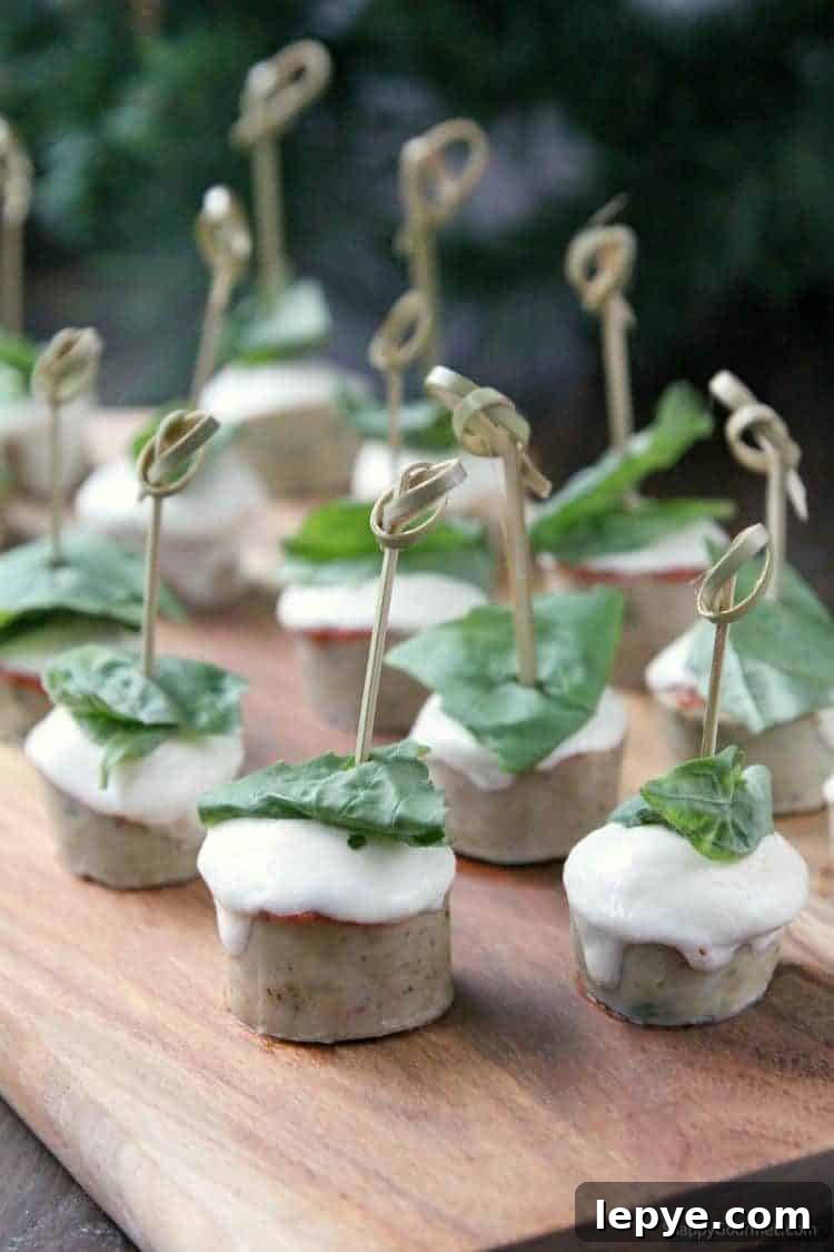EASY CHICKEN PARMESAN SAUSAGE BITES Easy Chicken Parmesan Sausage Bites on cutting board