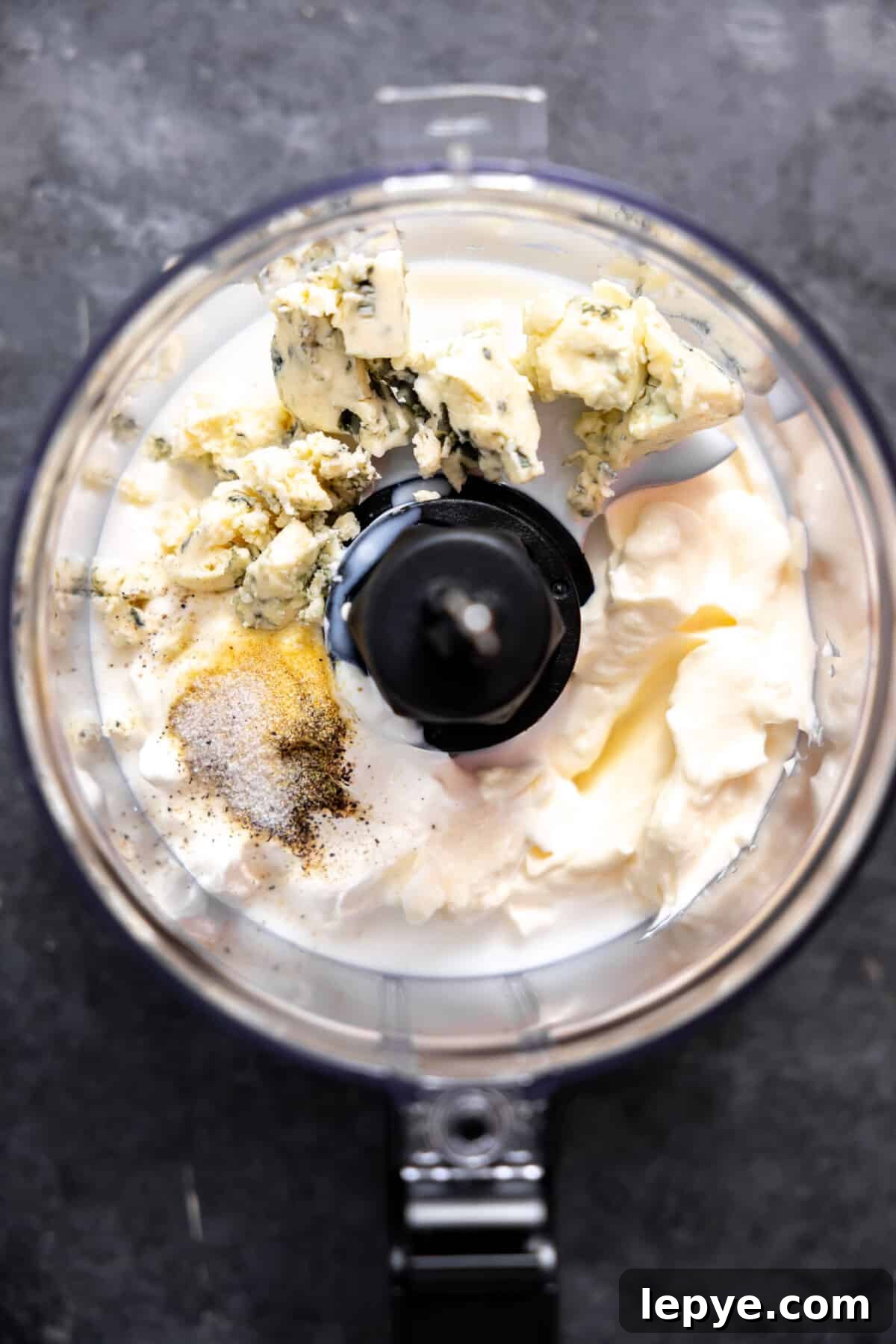 Creamy Blue Cheese Dressing Recipe for Salads and Wings 4 Food processor with ingredients to make homemade blue cheese dressing before blending.