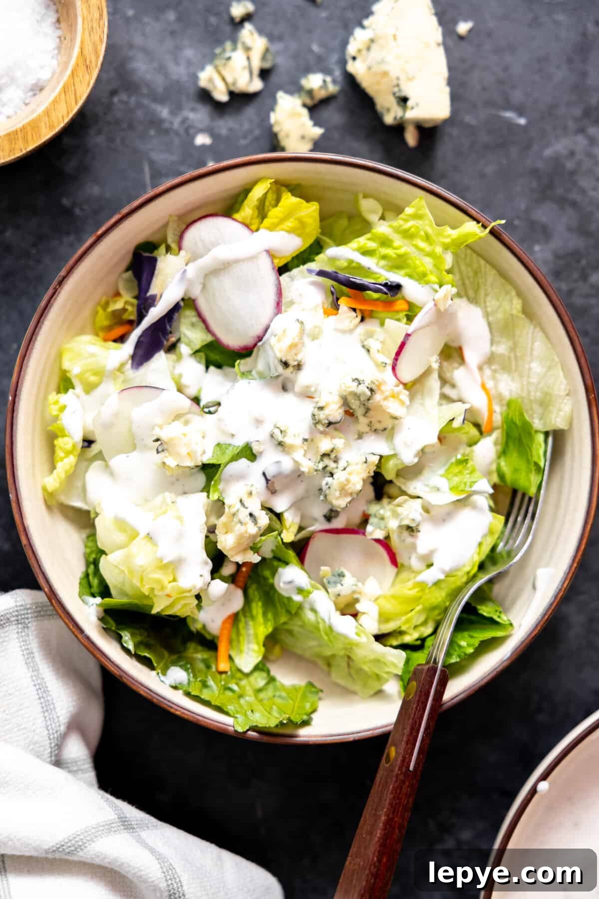 Creamy Blue Cheese Dressing Recipe for Salads and Wings 5 House salad topped with blue cheese dressing.