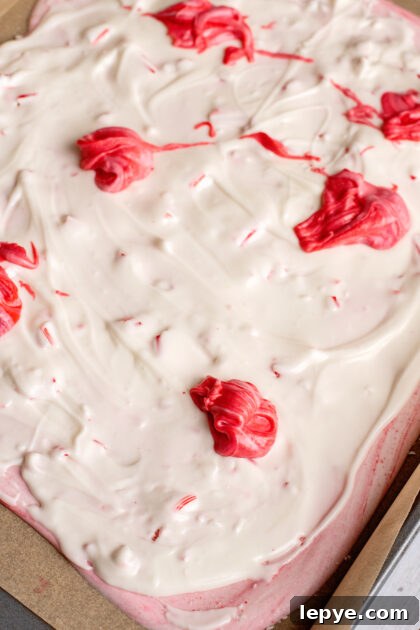 Dollop dyed almond bark over second layer.