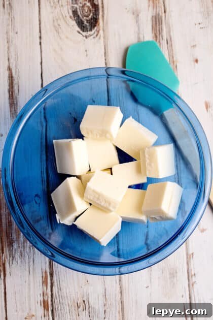 Place one pack of almond bark in microwave-safe bowl.