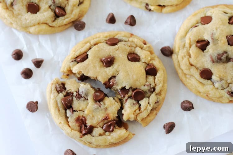 large chocolate chip cookie broken in half